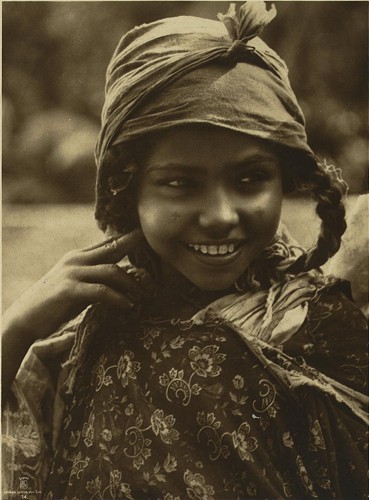[Tunisian girl, head-and-shoulders portrait, facing front]